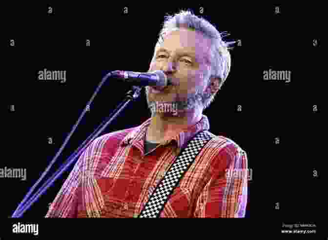 Billy Bragg Performing Live, Playing Guitar And Singing Into A Microphone, With A Crowd In The Background Billy Bragg: Still Suitable For Miners