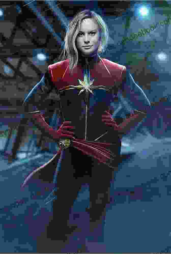 Captain Marvel Standing In A Heroic Pose, Wearing Her Red, Blue, And Gold Suit Marvel S Captain Marvel: The Art Of The Movie